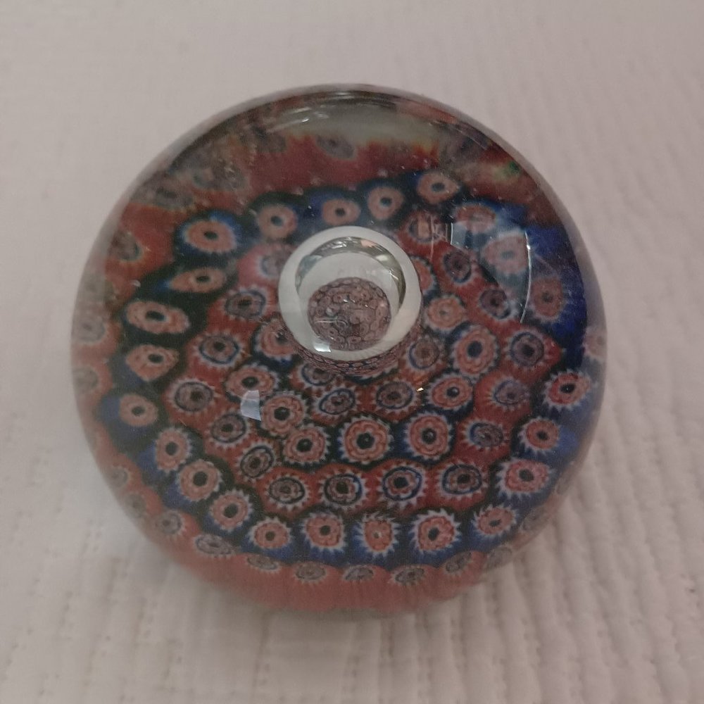 Large glass paper weight with colored beads in interior
